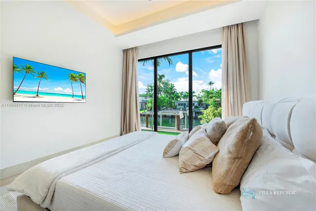 a bathroom with a double vanity sink mirror and shower