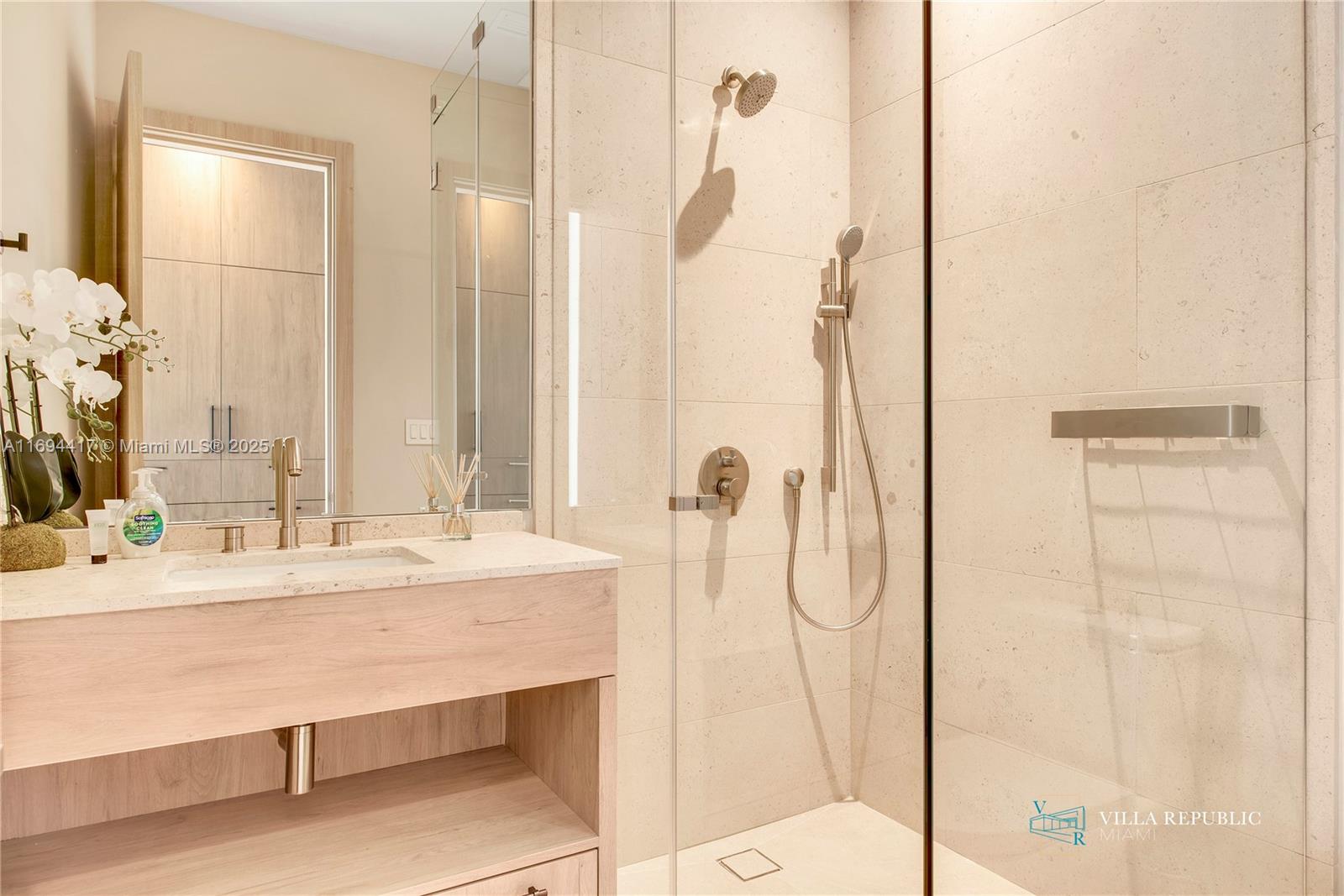 1200 Northeast 87th Street Miami, FL 33138 - Photo 39 of 58 a bathroom with a double vanity sink mirror and shower