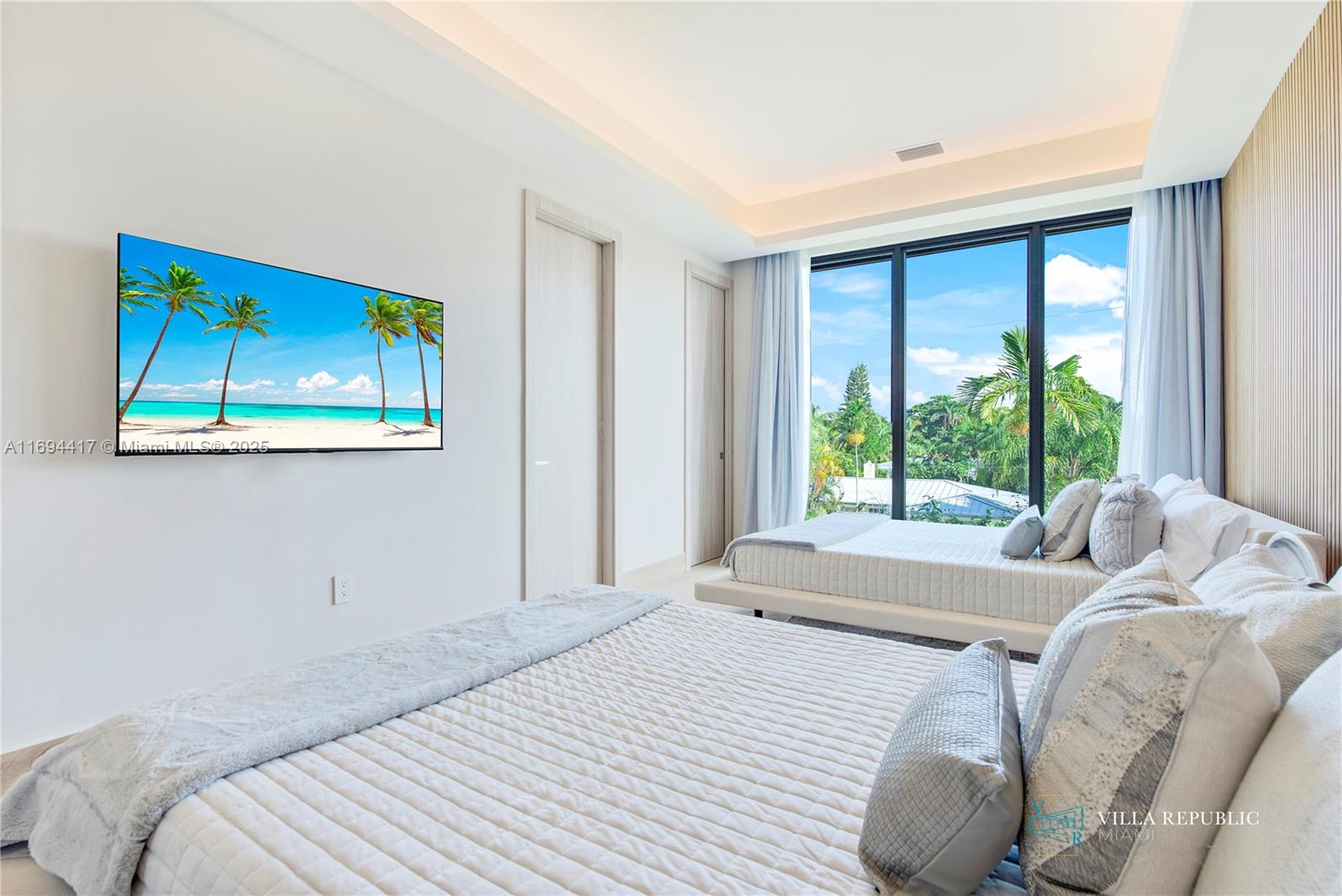 1200 Northeast 87th Street Miami, FL 33138 - Photo 40 of 58 a bedroom with a bed and a large window