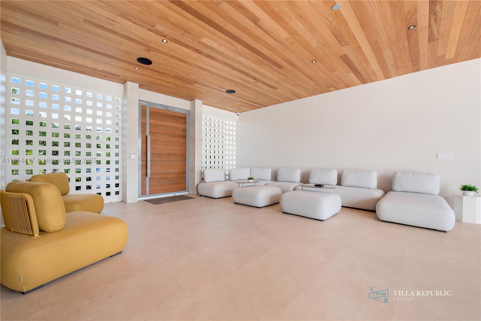 1200 Northeast 87th Street Miami, FL 33138 - Photo 4 of 58 a bedroom with furniture and a large window