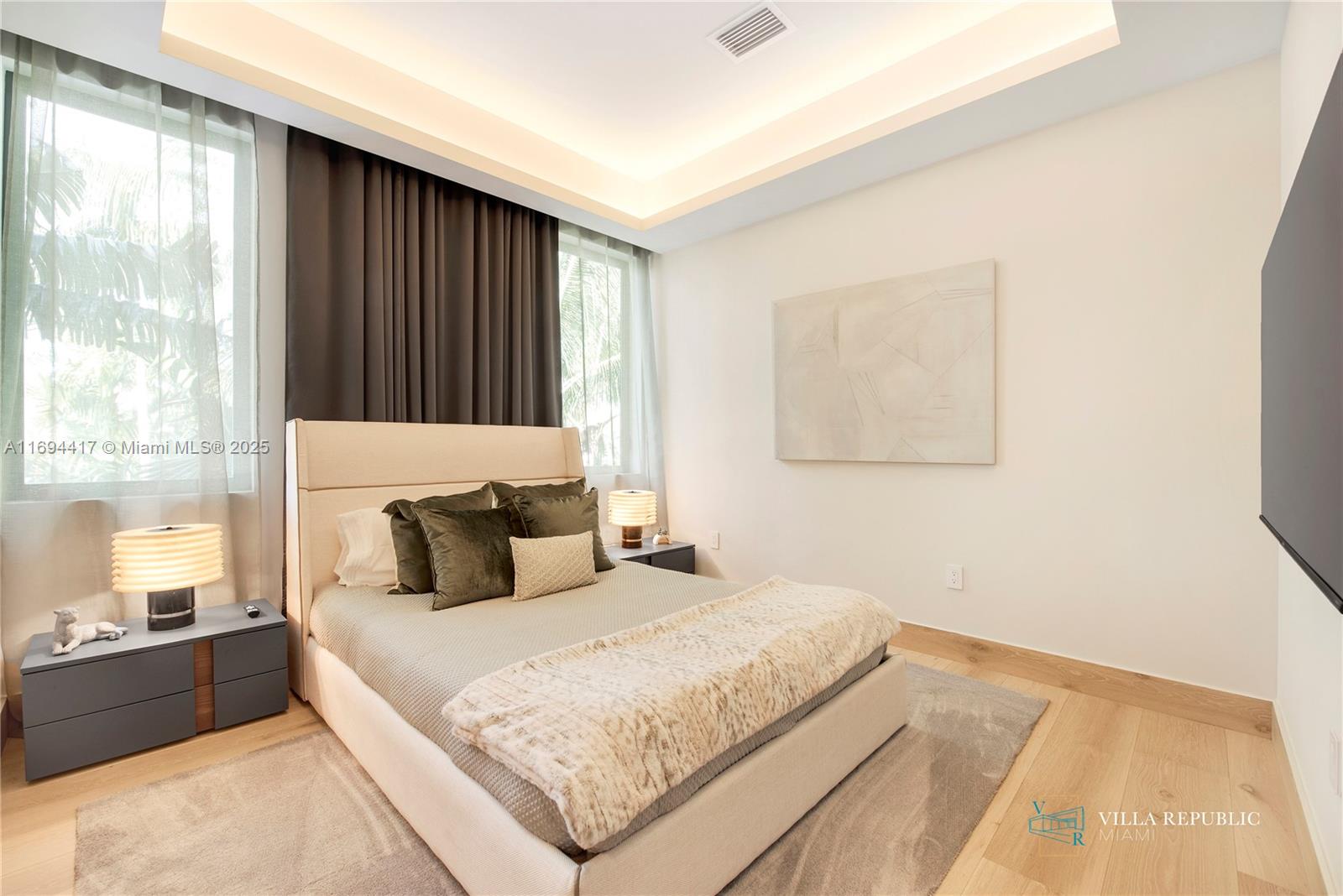 1200 Northeast 87th Street Miami, FL 33138 - Photo 44 of 58 a bedroom with a large bed and a window