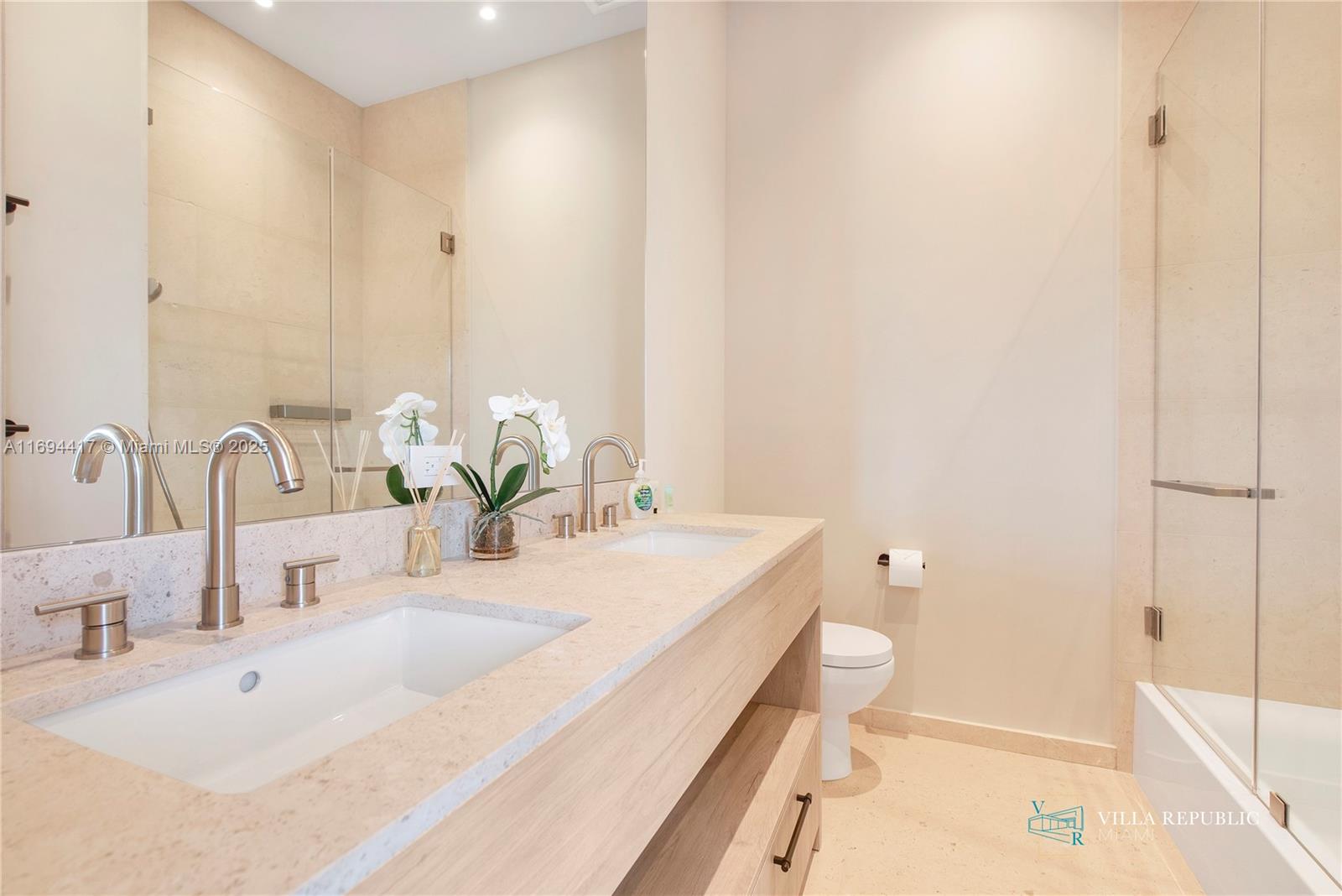 1200 Northeast 87th Street Miami, FL 33138 - Photo 47 of 58 a bathroom with a double vanity sink toilet and shower