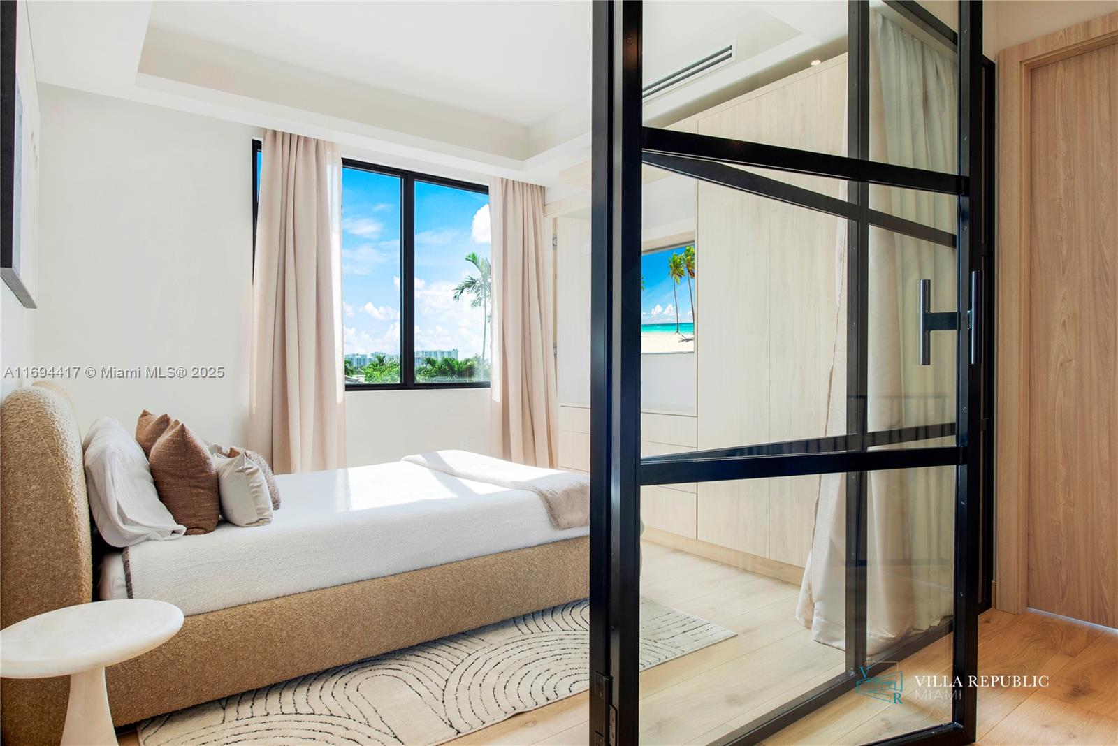 1200 Northeast 87th Street Miami, FL 33138 - Photo 49 of 58 a bedroom with a bed and a window