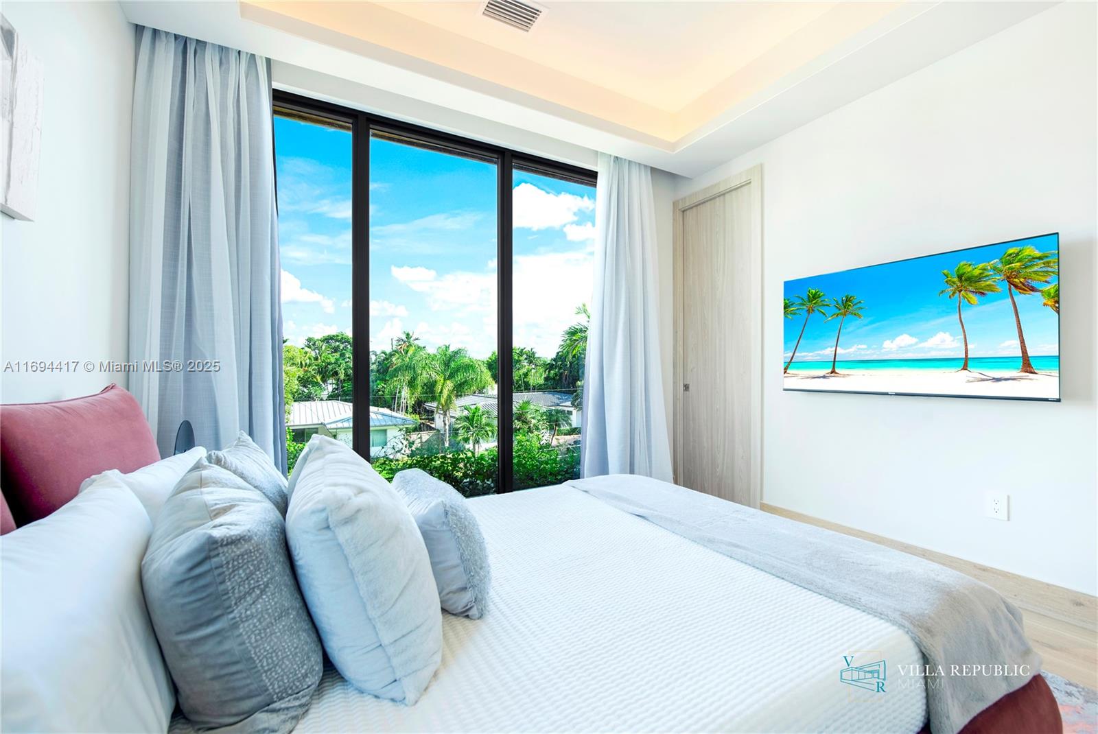 1200 Northeast 87th Street Miami, FL 33138 - Photo 54 of 58 a bedroom with bed and a large window