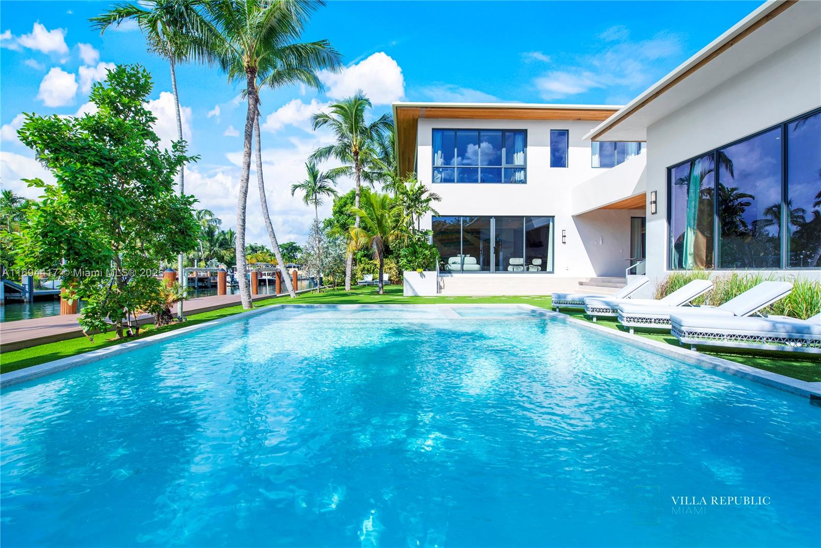 1200 Northeast 87th Street Miami, FL 33138 - Photo 56 of 58 a front view of a house with a yard