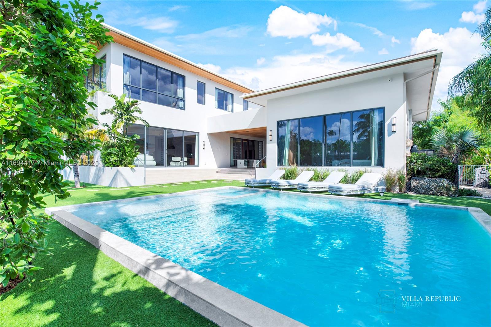 1200 Northeast 87th Street Miami, FL 33138 - Photo 58 of 58 a view of an house with swimming pool and porch