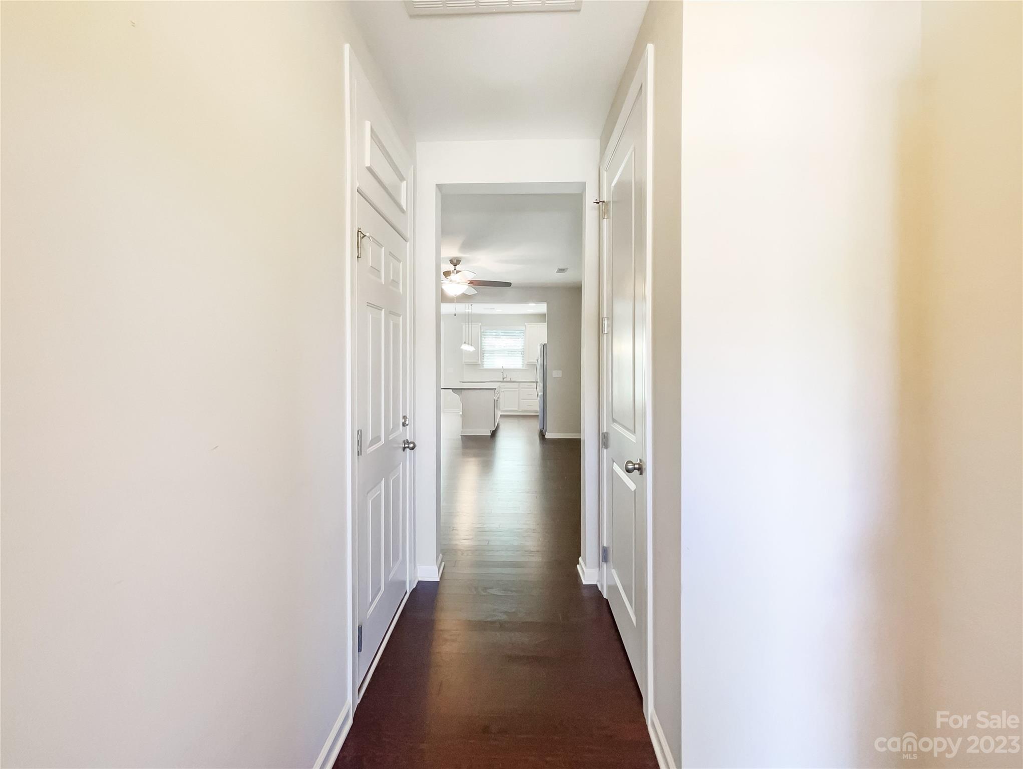 1004 Archibald Avenue Fort Mill, SC 29708 - Photo 5 of 18 a view of a hallway with wooden floor