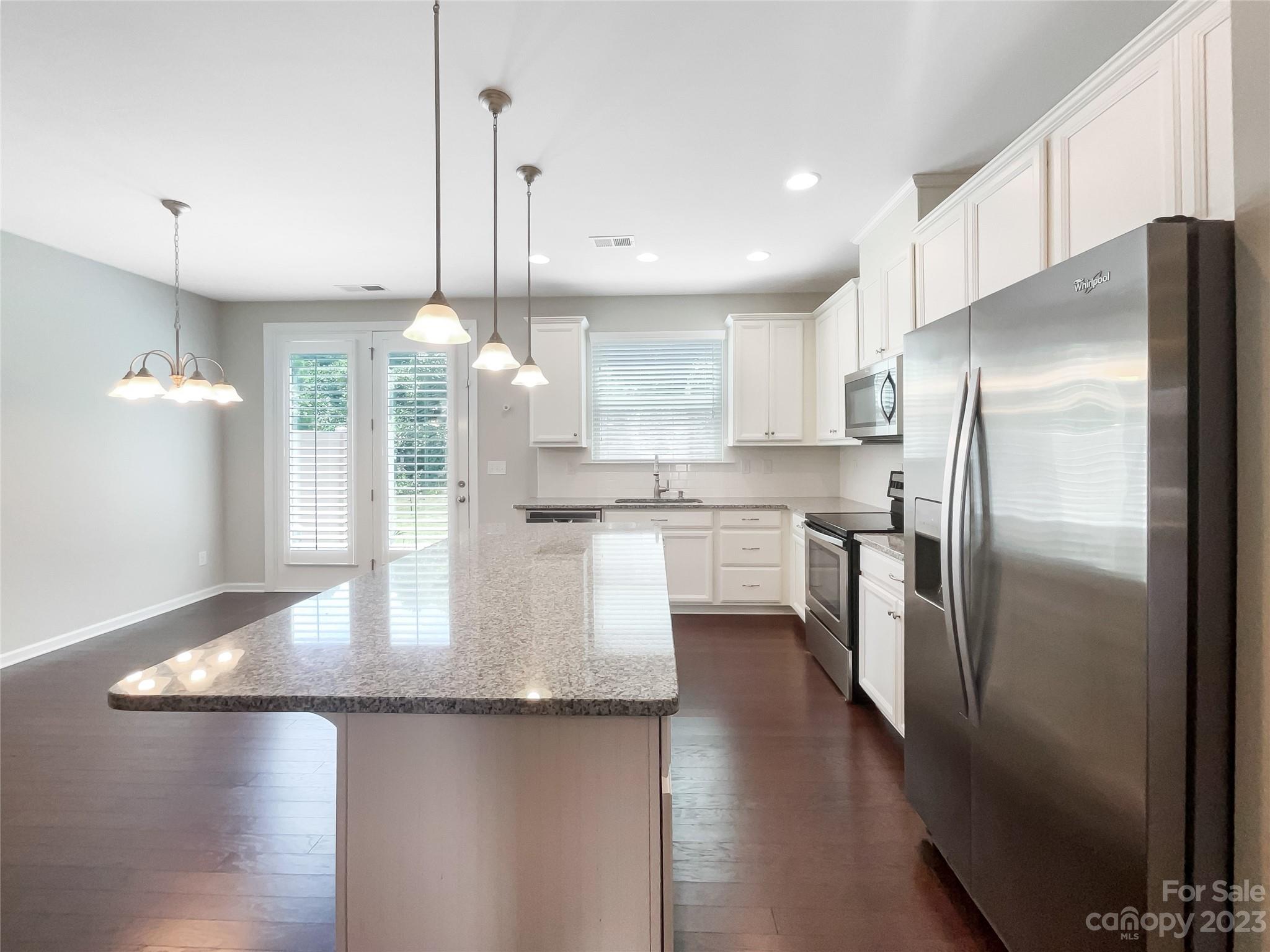 1004 Archibald Avenue Fort Mill, SC 29708 - Photo 8 of 18 a kitchen with stainless steel appliances granite countertop a refrigerator a sink and a stove