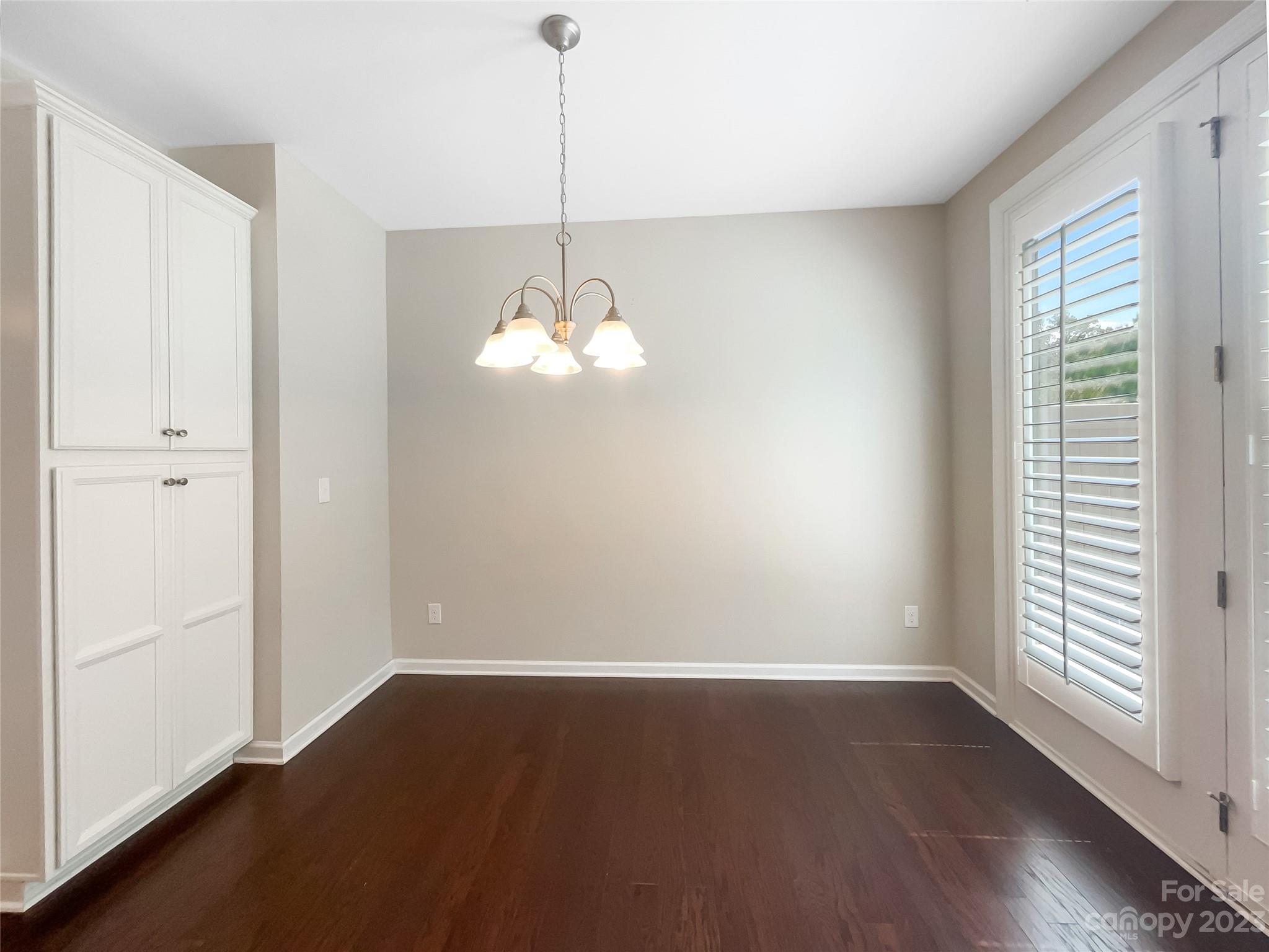 1004 Archibald Avenue Fort Mill, SC 29708 - Photo 9 of 18 a view of a room with wooden floor and windows