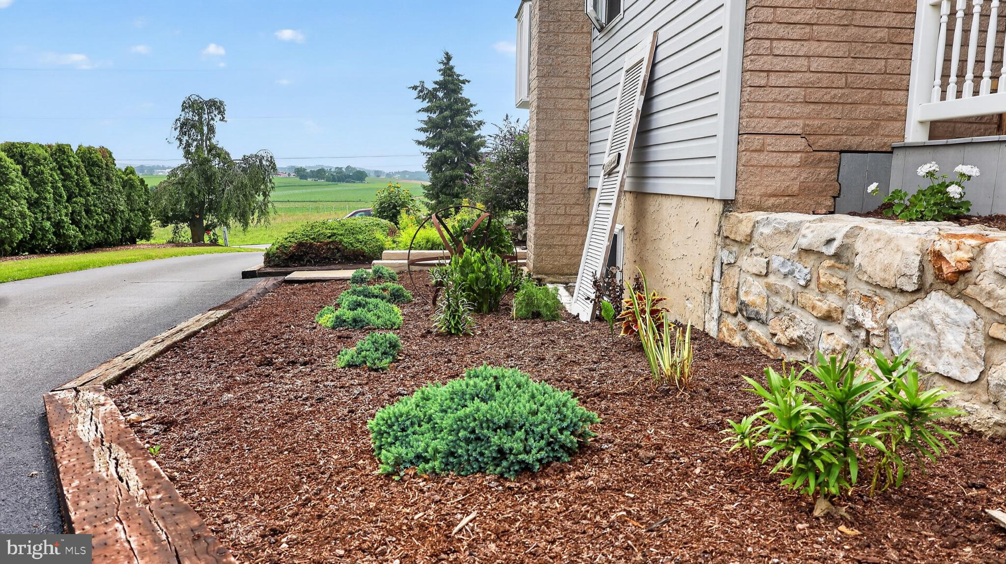 285 School Lane Road Gap, PA 17527 - Photo 33 of 56 Lush landscaping meets serene countryside.