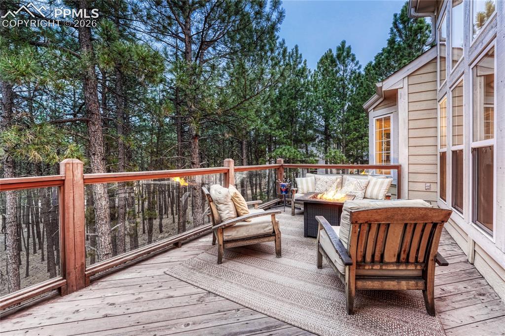 15585 Falcon Ridge Court Colorado Springs, CO 80921 - Photo 35 of 50 a view of a wooden deck with furniture