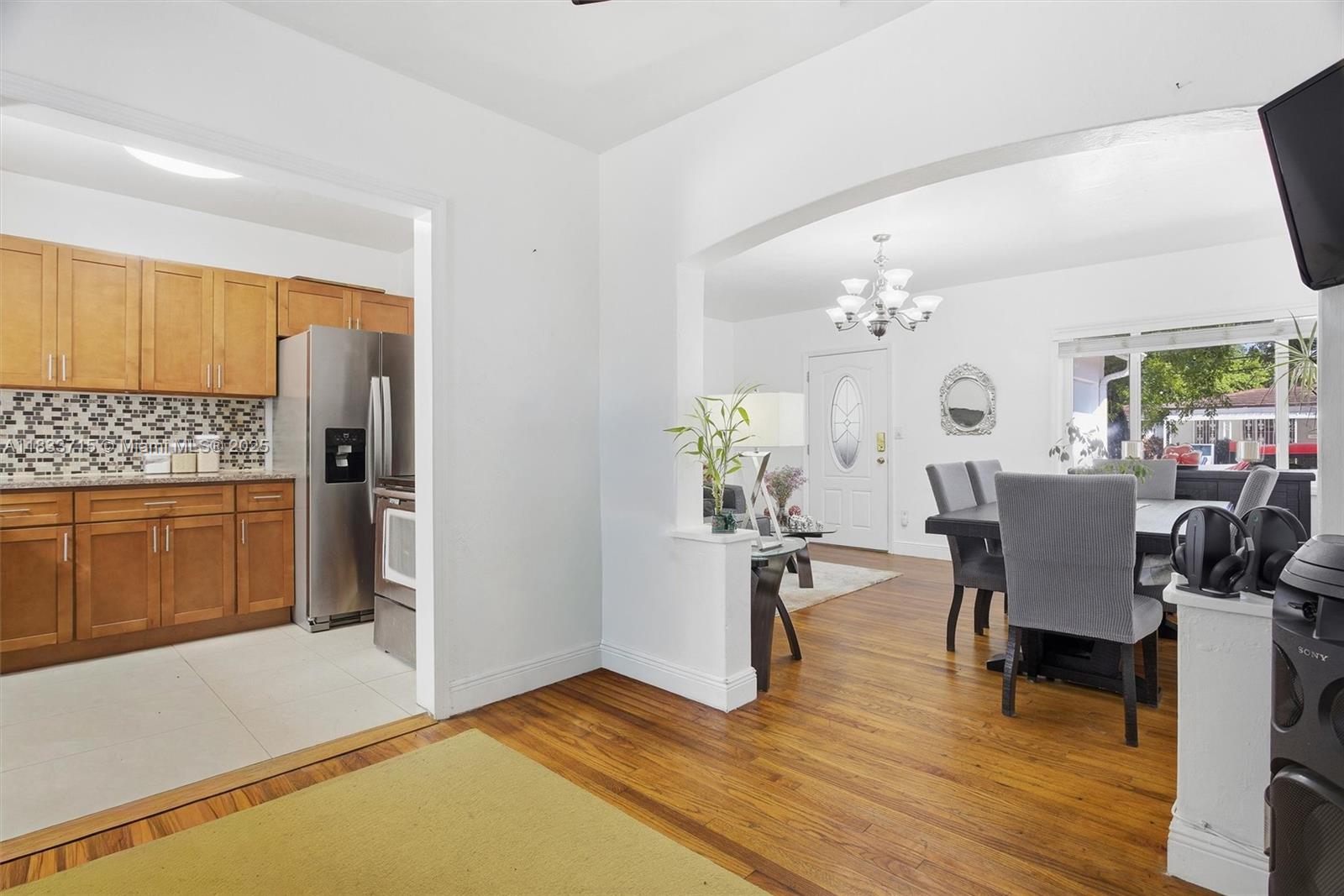 104 Southwest 40th Avenue Miami, FL 33134 - Photo 13 of 43 a view of a dining room with furniture and wooden floor