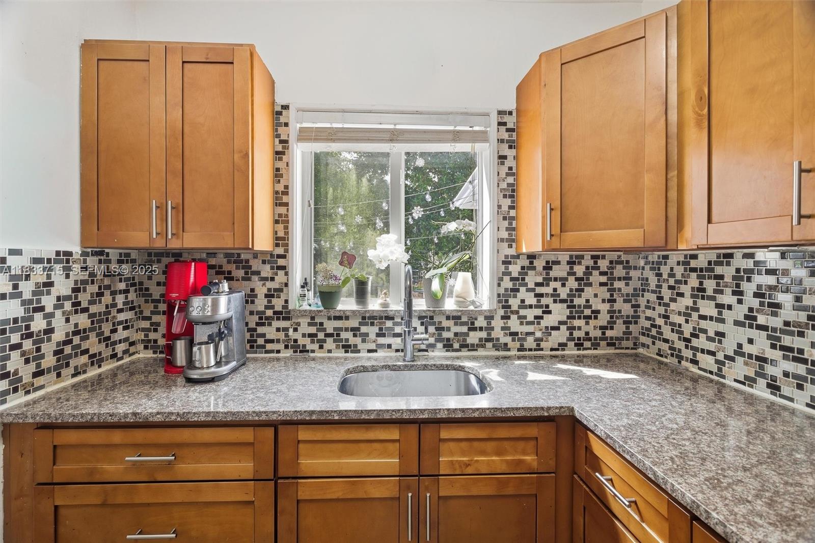 104 Southwest 40th Avenue Miami, FL 33134 - Photo 17 of 43 a kitchen with a sink and large window