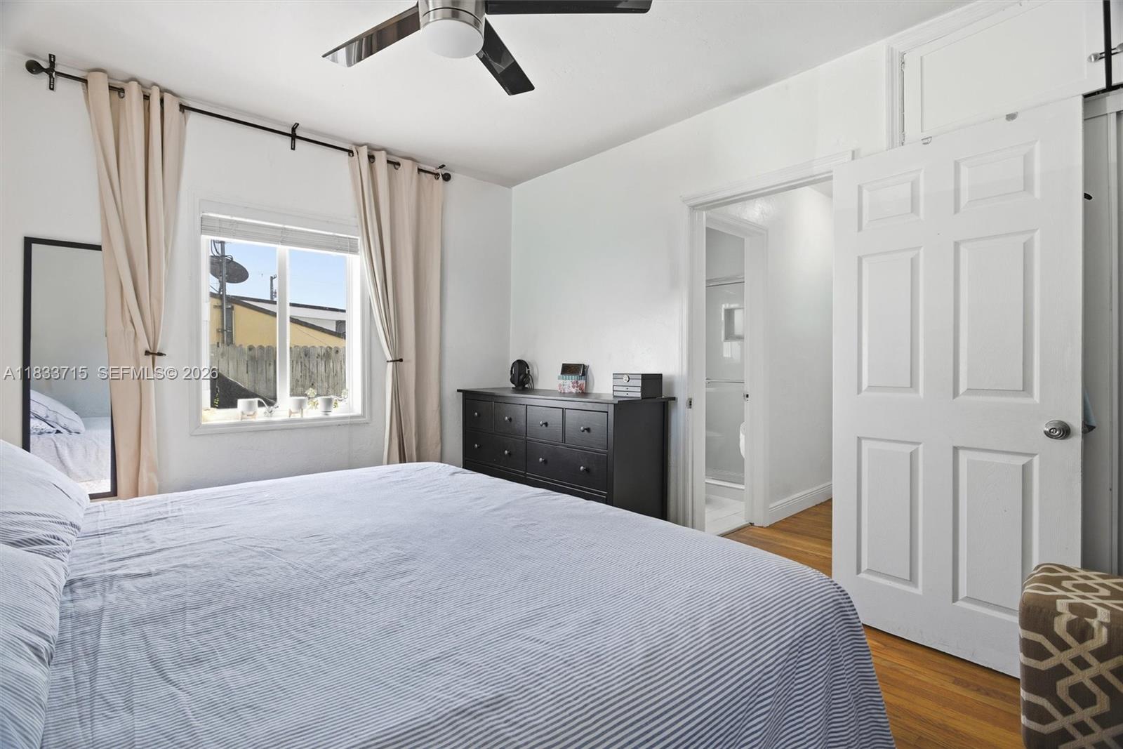 104 Southwest 40th Avenue Miami, FL 33134 - Photo 21 of 41 a bedroom with a bed dresser and a window