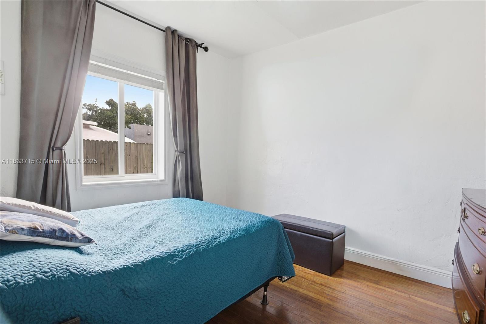 104 Southwest 40th Avenue Miami, FL 33134 - Photo 22 of 42 a bedroom with a bed and a window