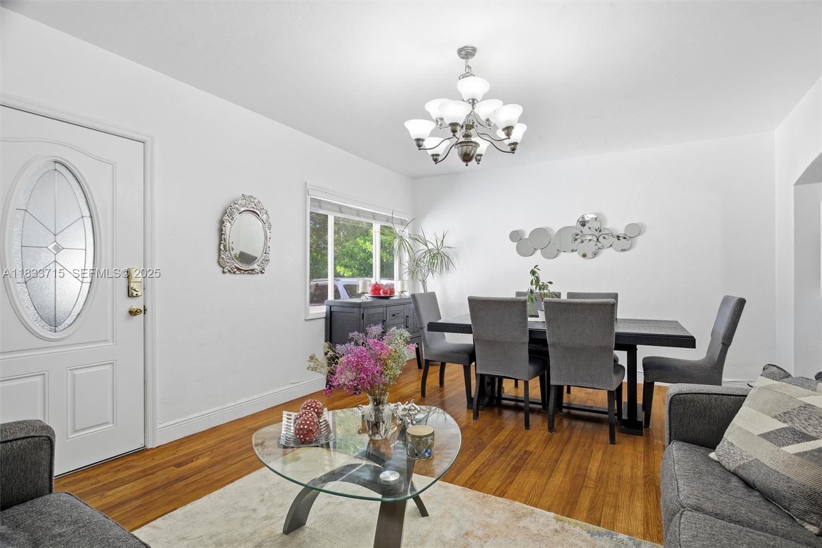 104 Southwest 40th Avenue Miami, FL 33134 - Photo 7 of 43 a view of a dining room with furniture and wooden floor