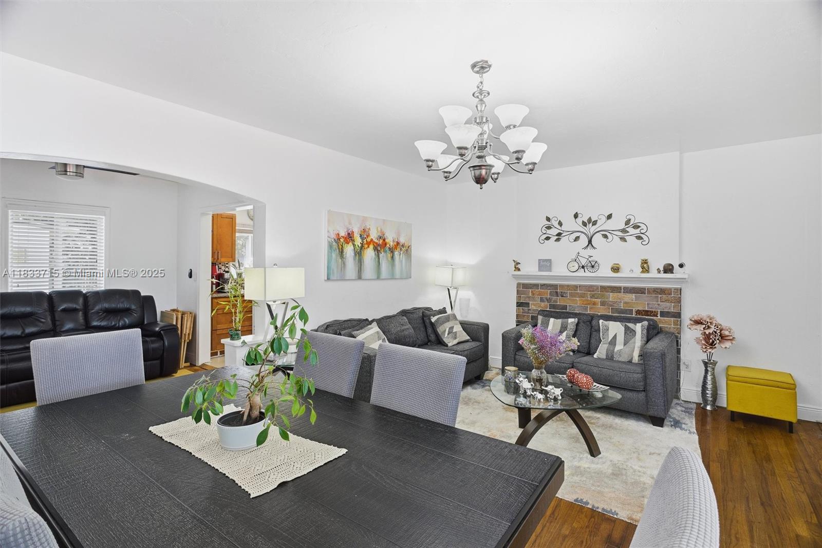 104 Southwest 40th Avenue Miami, FL 33134 - Photo 10 of 42 a living room with furniture and a chandelier