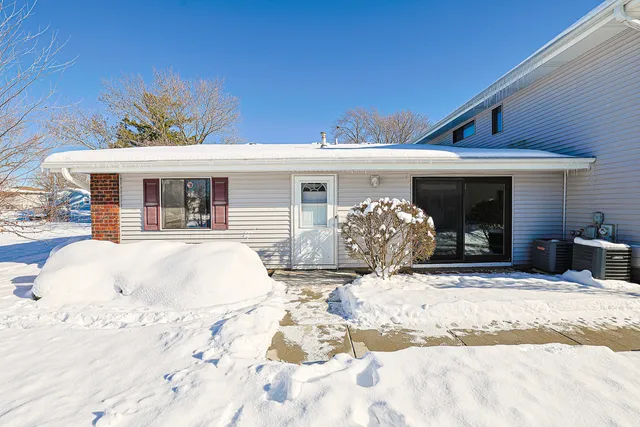 a view of a house with snow on the roof