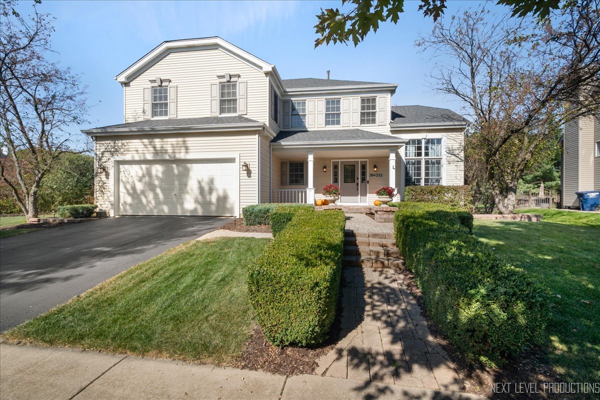 39W252 Bartelt Road Geneva, IL 60134 - Photo 1 of 34 a front view of a house with a yard
