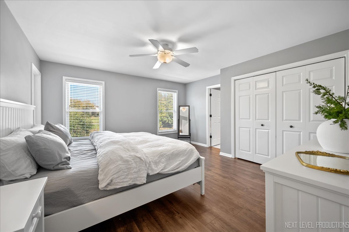 39W252 Bartelt Road Geneva, IL 60134 - Photo 15 of 34 a bedroom with a bed and dresser with wooden floor