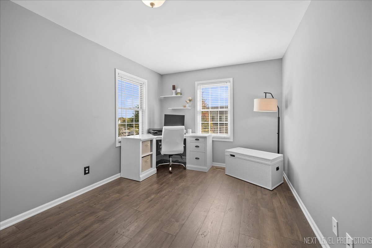 39W252 Bartelt Road Geneva, IL 60134 - Photo 21 of 34 a living room with furniture and a wooden floor