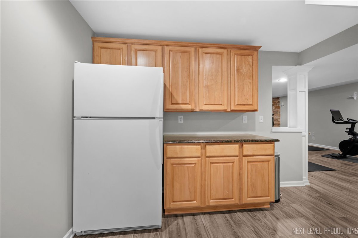 39W252 Bartelt Road Geneva, IL 60134 - Photo 25 of 34 a white refrigerator freezer sitting in a kitchen