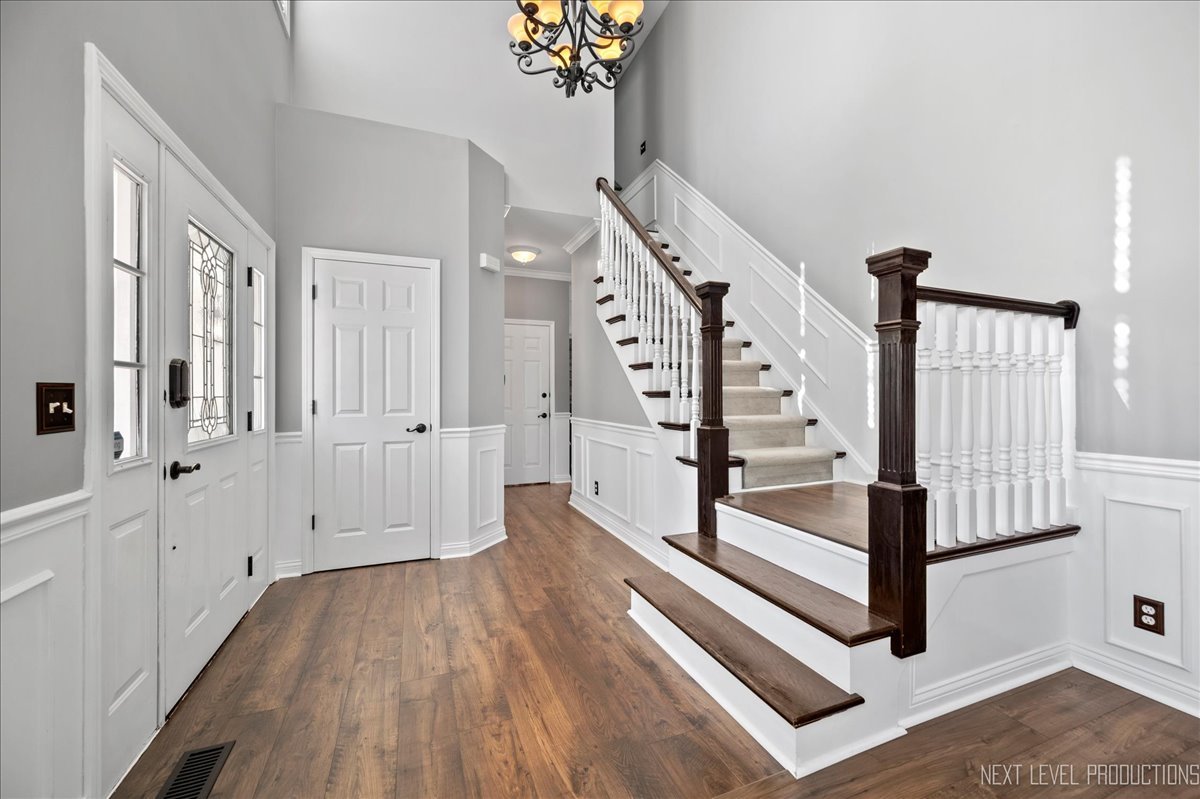 39W252 Bartelt Road Geneva, IL 60134 - Photo 3 of 34 a view of entryway with stairs and wooden floor