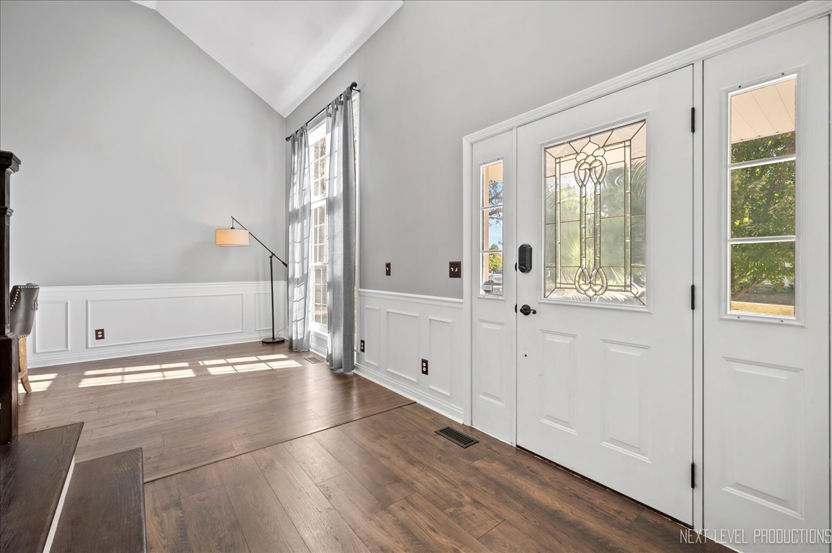 39W252 Bartelt Road Geneva, IL 60134 - Photo 4 of 34 a view of an empty room with wooden floor and a window