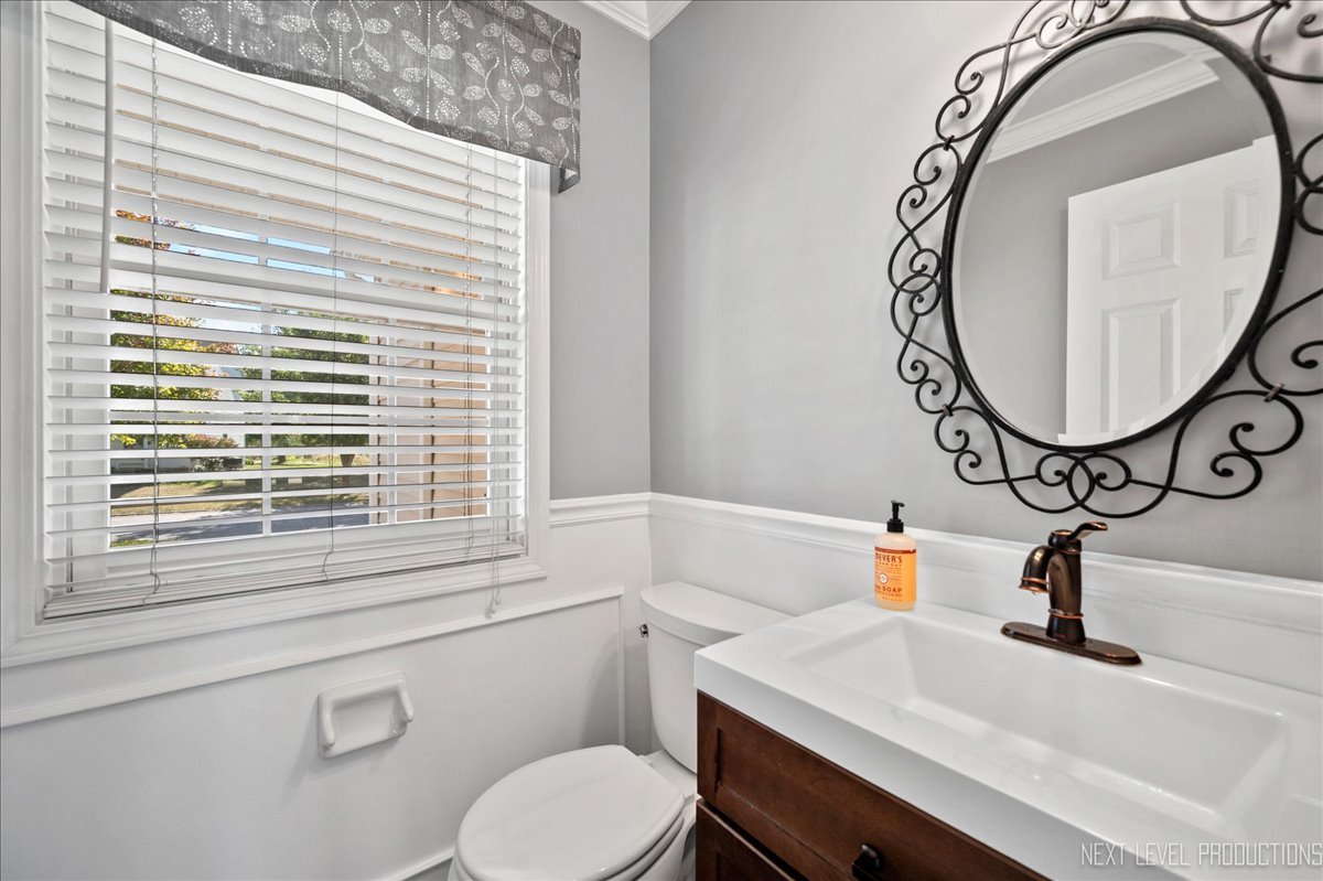 39W252 Bartelt Road Geneva, IL 60134 - Photo 8 of 34 a bathroom with a sink and a mirror
