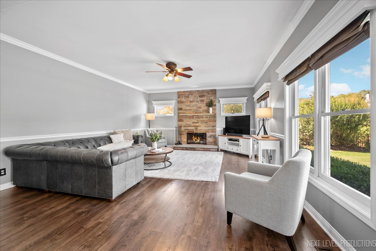 39W252 Bartelt Road Geneva, IL 60134 - Photo 10 of 34 a living room with fireplace furniture and a flat screen tv