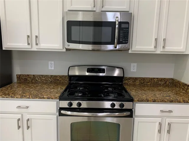 a view of a chandelier in a room with a mirror
