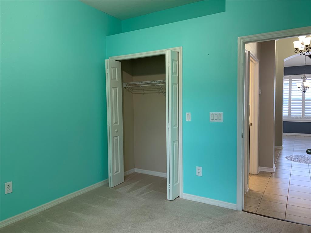 10308 Holland Road Riverview, FL 33578 - Photo 25 of 66 an empty room with closet and a bathroom
