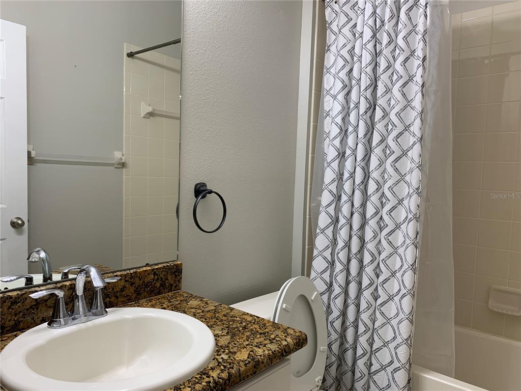 10308 Holland Road Riverview, FL 33578 - Photo 29 of 66 a bathroom with a sink and a mirror