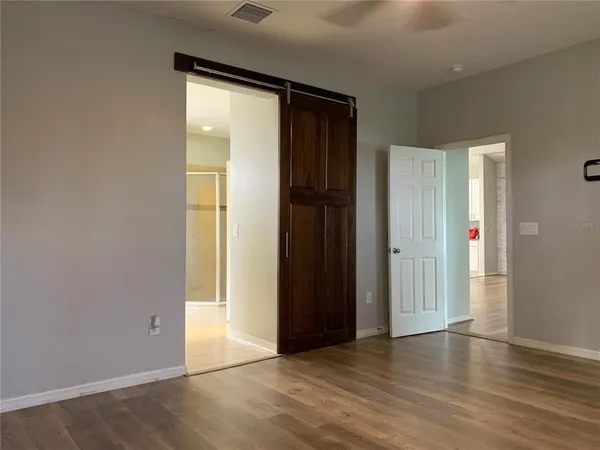 a bedroom with furniture and window