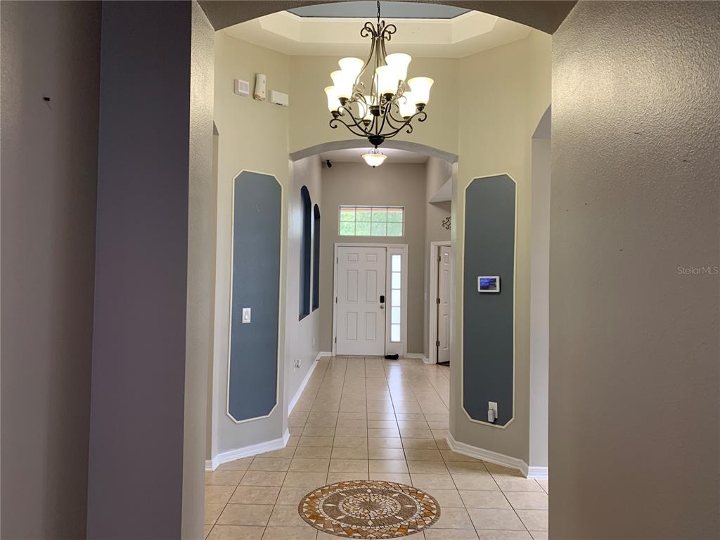 10308 Holland Road Riverview, FL 33578 - Photo 39 of 66 a bathroom with a granite countertop shower a mirror and a sink