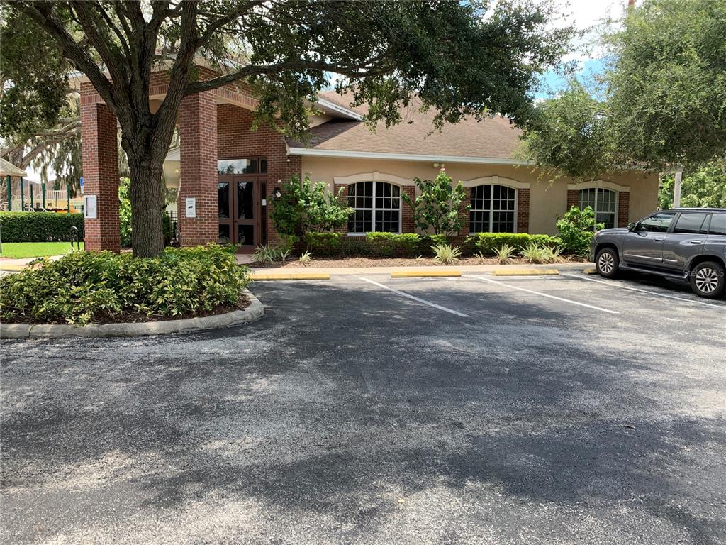 10308 Holland Road Riverview, FL 33578 - Photo 63 of 66 a view of a house with a backyard and a garage