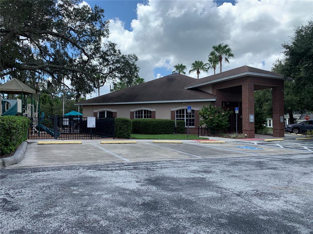 10308 Holland Road Riverview, FL 33578 - Photo 66 of 66 a front view of a house with a yard and potted plants