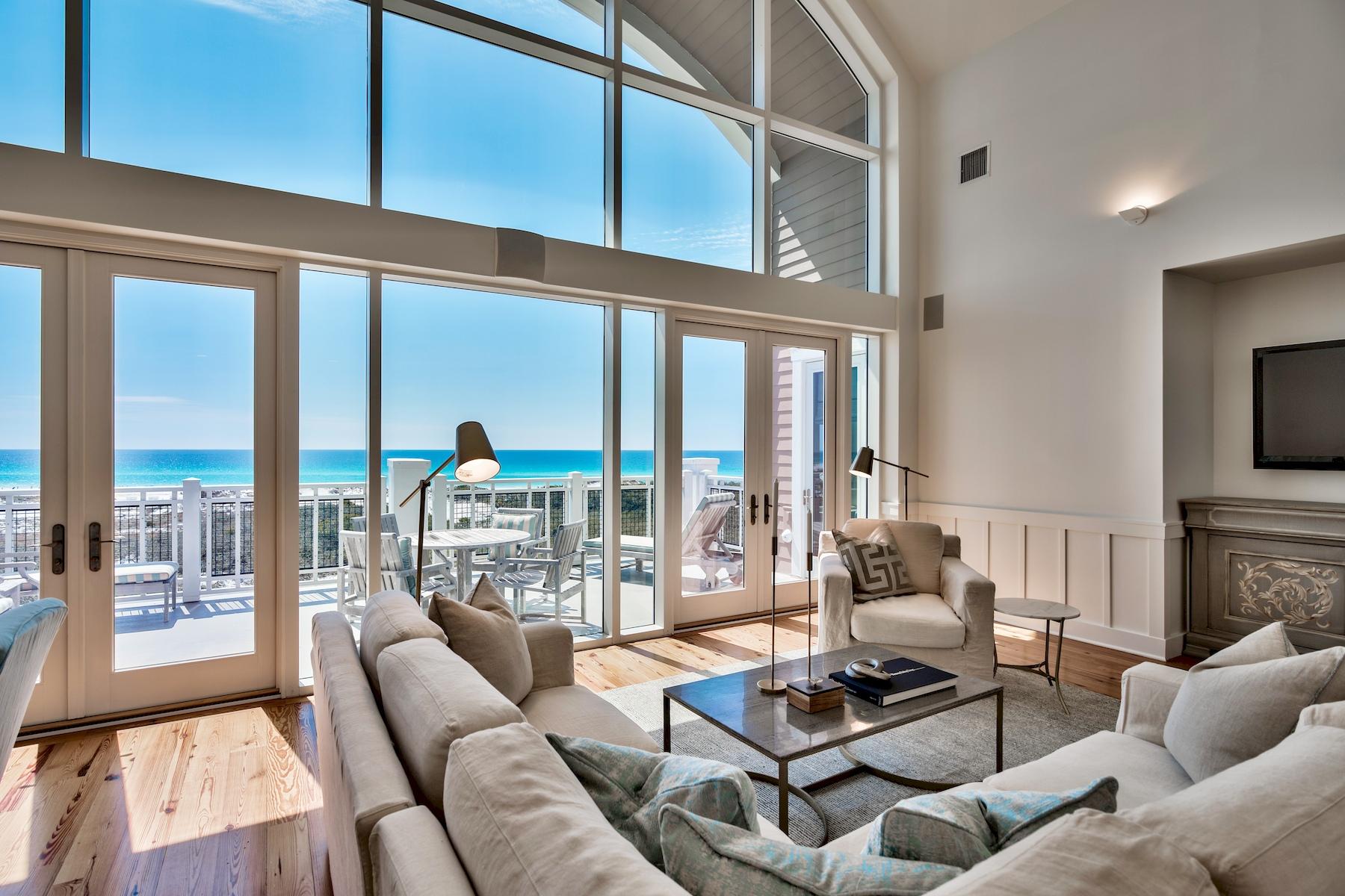 37 Compass Point Way South, Unit 424 Watersound, FL 32461 - Photo 12 of 26 a living room with furniture a floor to ceiling window and a flat screen tv