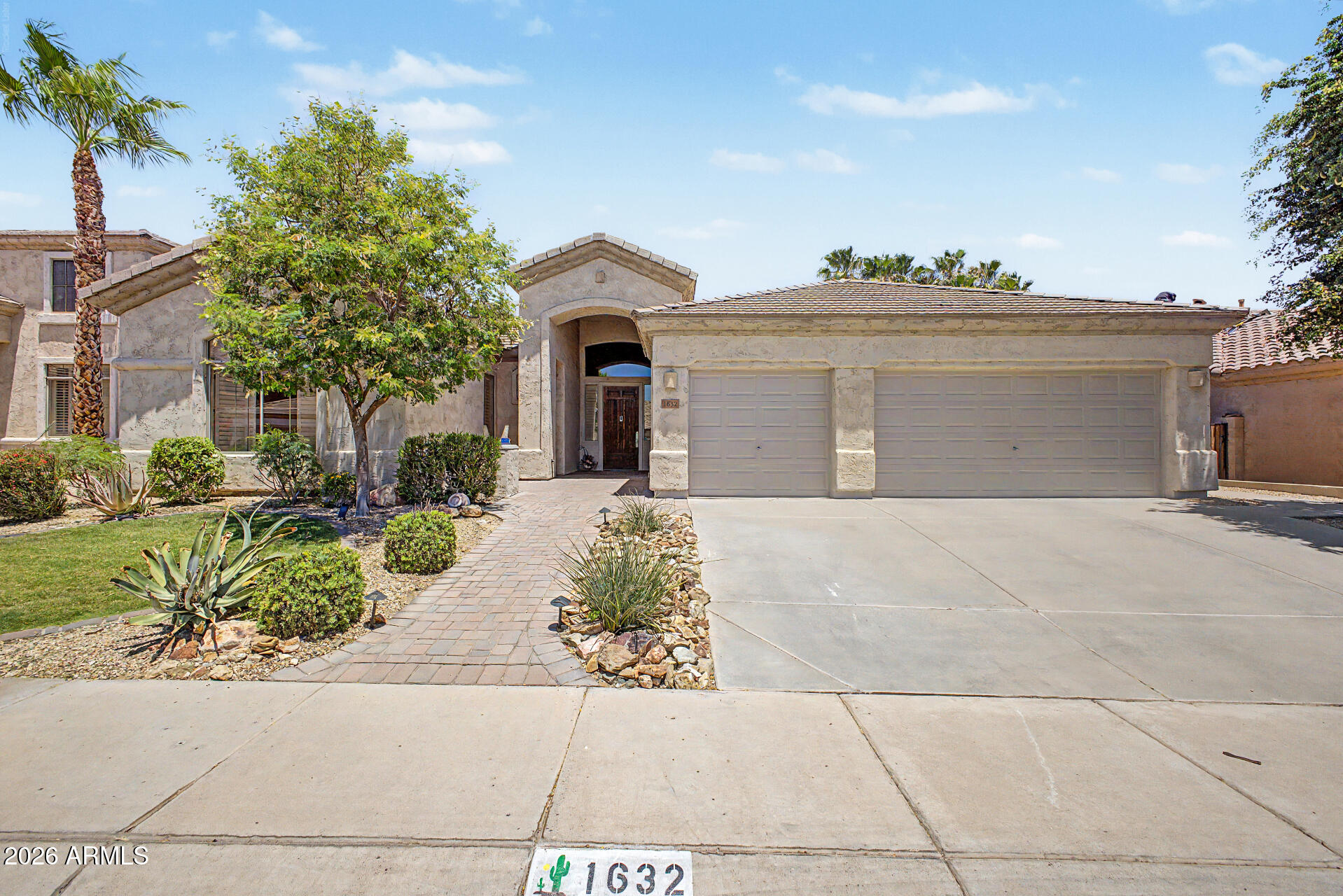 1632 West Frye Road Phoenix, AZ 85045 - Photo 1 of 37 a front view of a house with a garden
