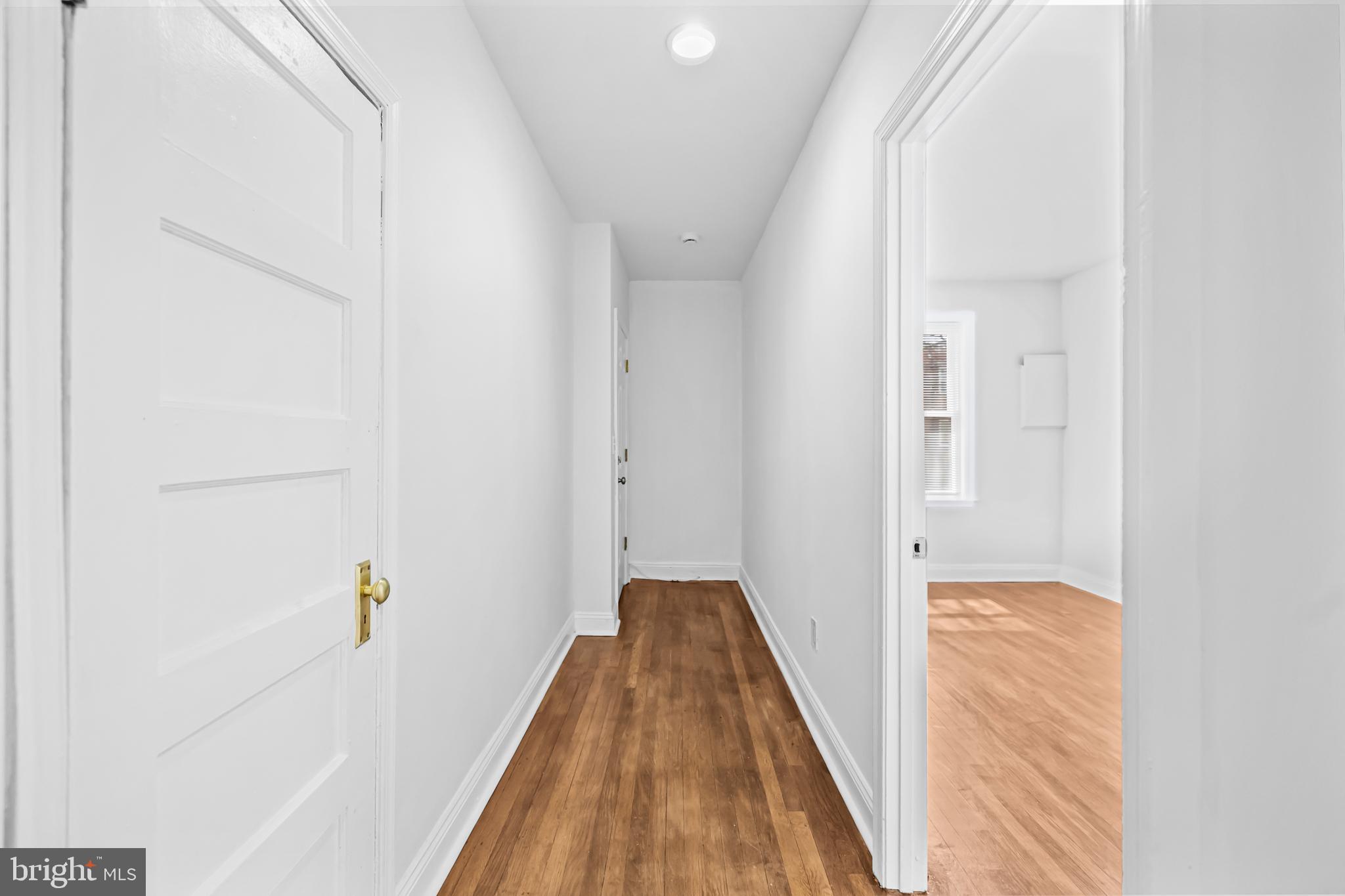 1508 V Street Southeast Washington, DC 20020 - Photo 11 of 41 a view of a hallway with wooden floor and staircase