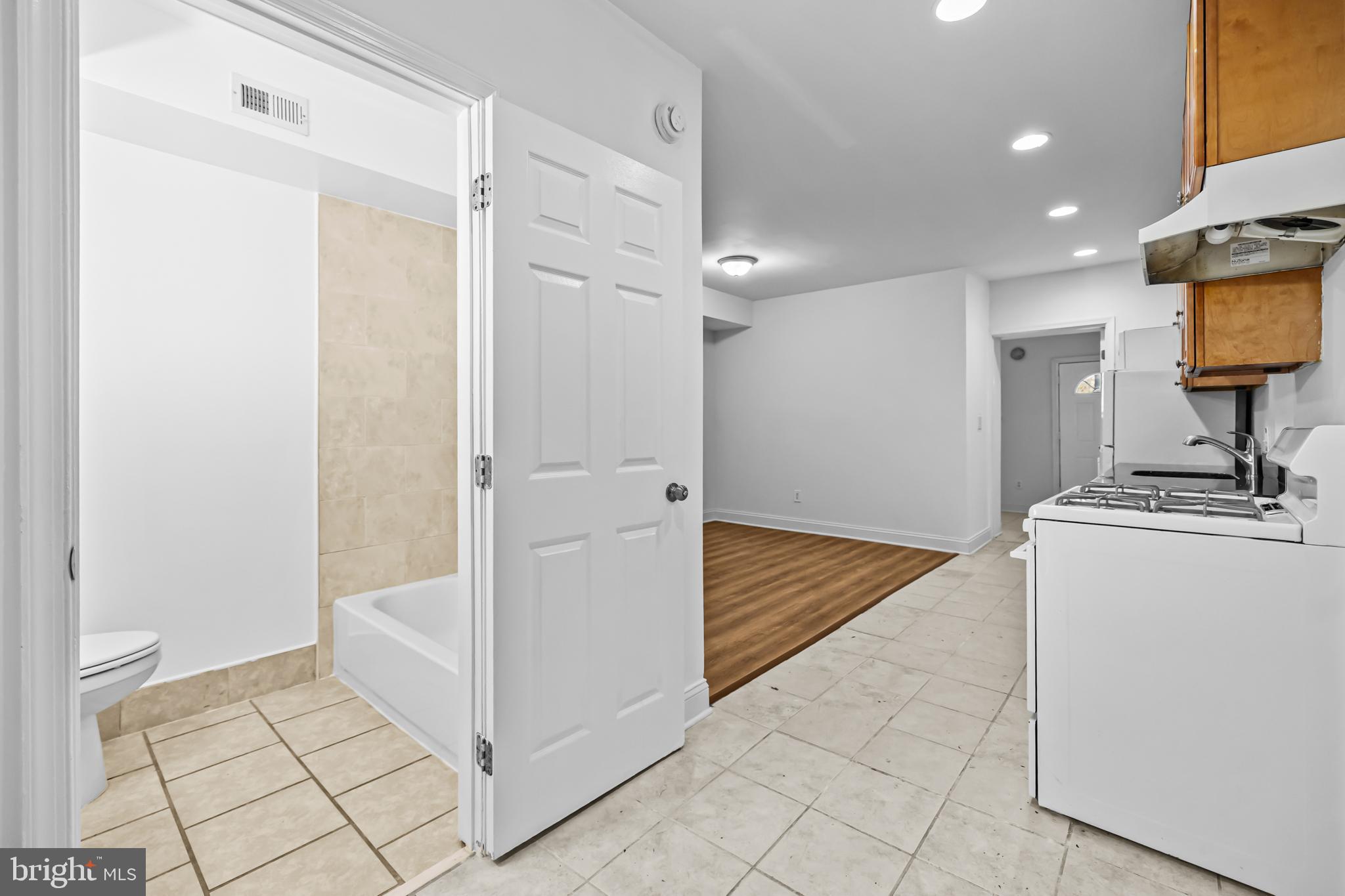 1508 V Street Southeast Washington, DC 20020 - Photo 15 of 41 a view of a hallway with wooden floor and a living room