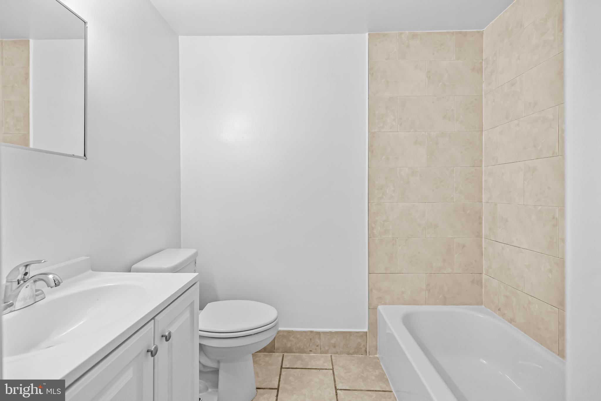 1508 V Street Southeast Washington, DC 20020 - Photo 16 of 41 a bathroom with a sink toilet and shower