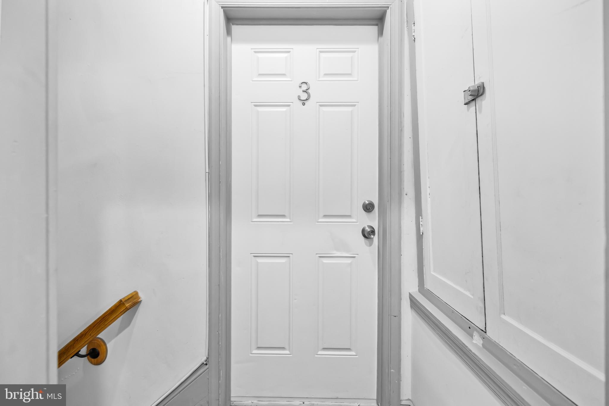 1508 V Street Southeast Washington, DC 20020 - Photo 19 of 41 a view of a hallway with wooden floor and closet