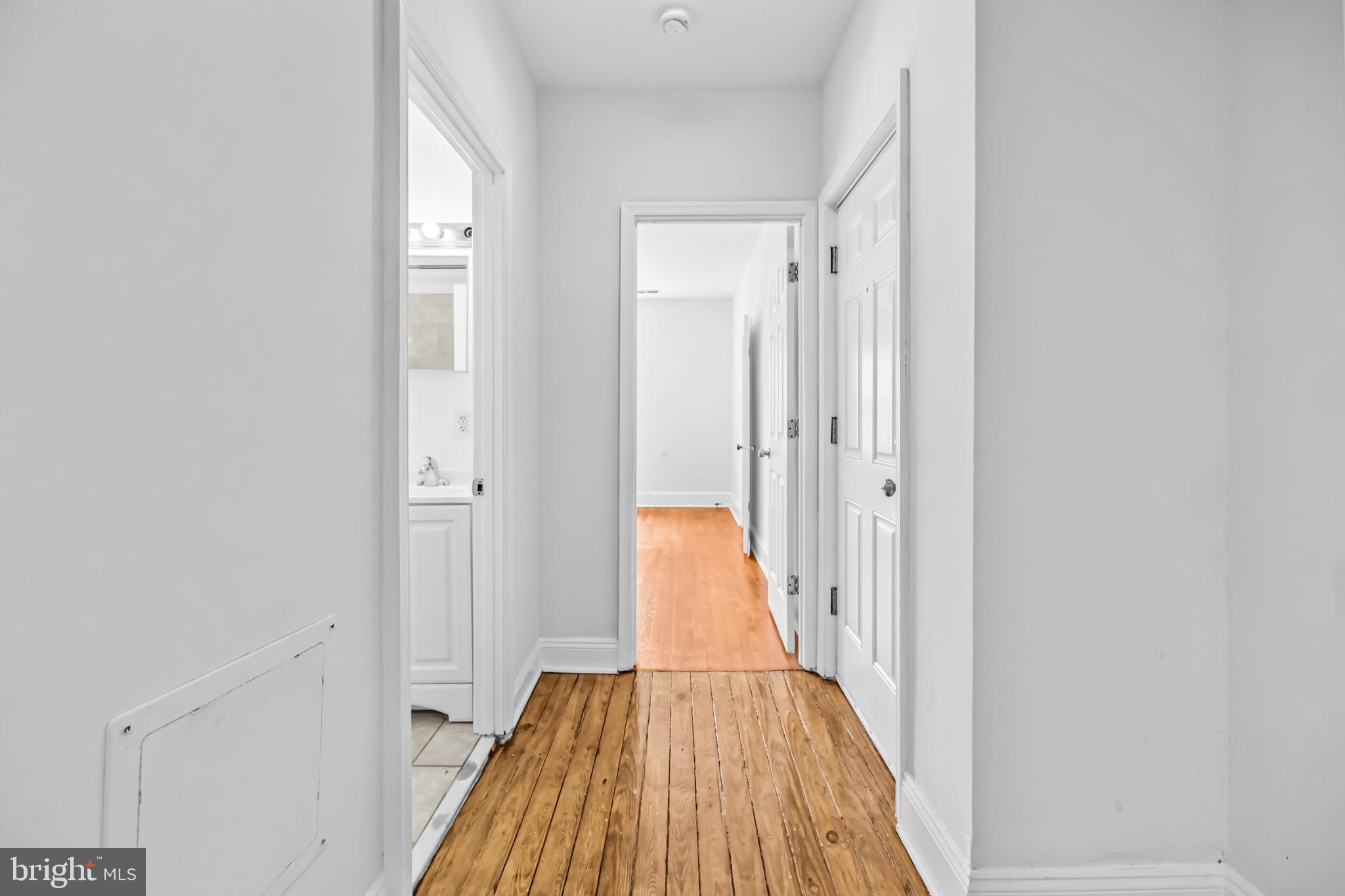 1508 V Street Southeast Washington, DC 20020 - Photo 24 of 41 a view of a hallway with wooden floor and staircase