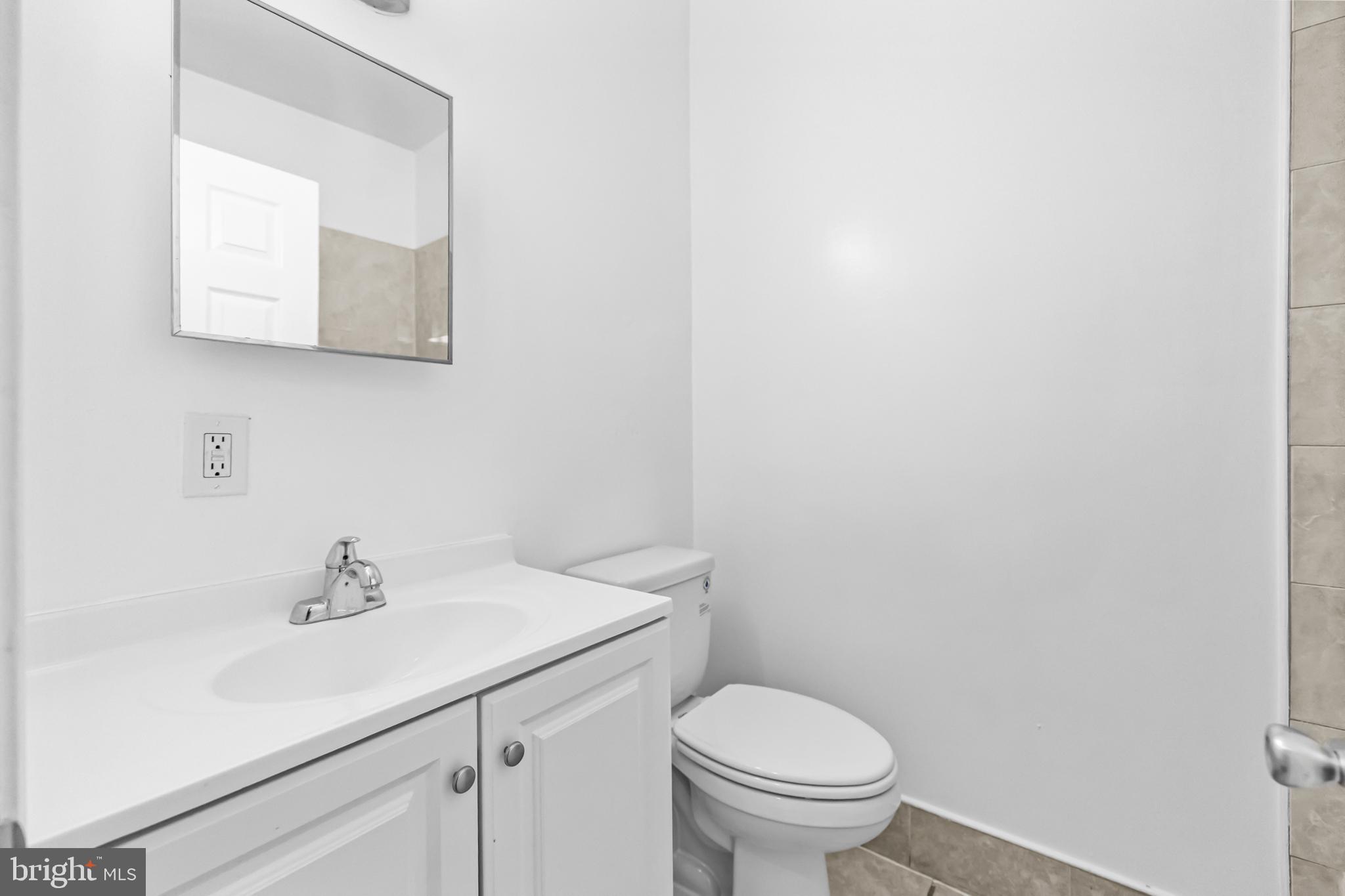 1508 V Street Southeast Washington, DC 20020 - Photo 25 of 41 a bathroom with a sink toilet and mirror