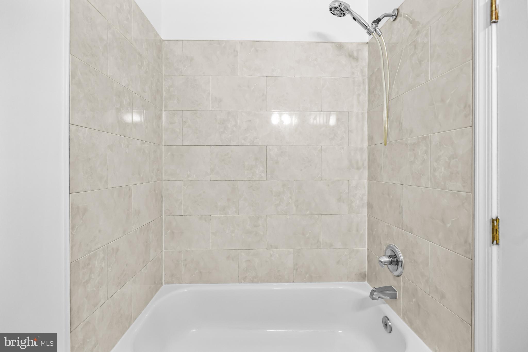 1508 V Street Southeast Washington, DC 20020 - Photo 26 of 41 a bathroom with a shower and a bath tub