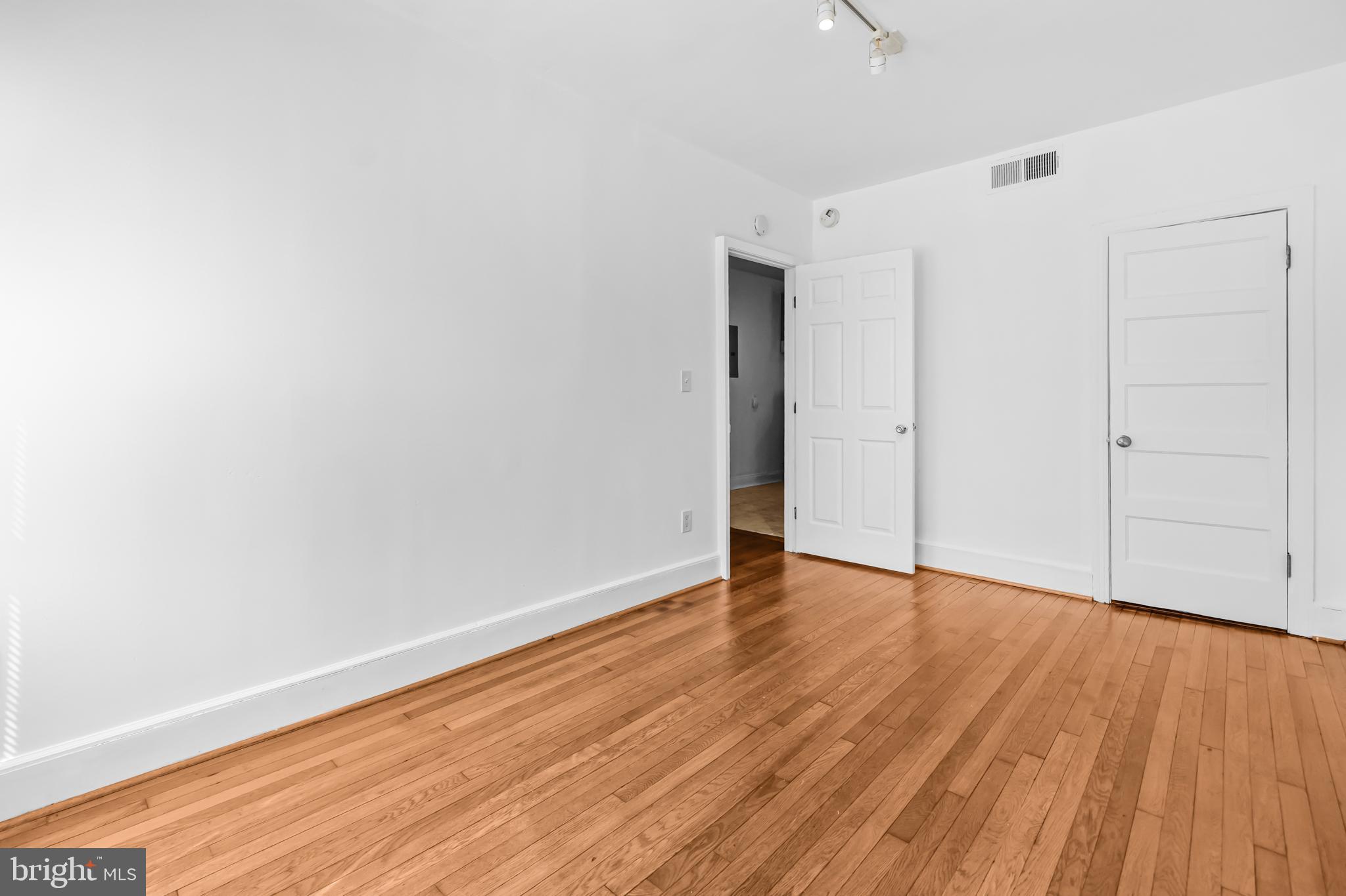 1508 V Street Southeast Washington, DC 20020 - Photo 5 of 41 a view of an empty room with wooden floor