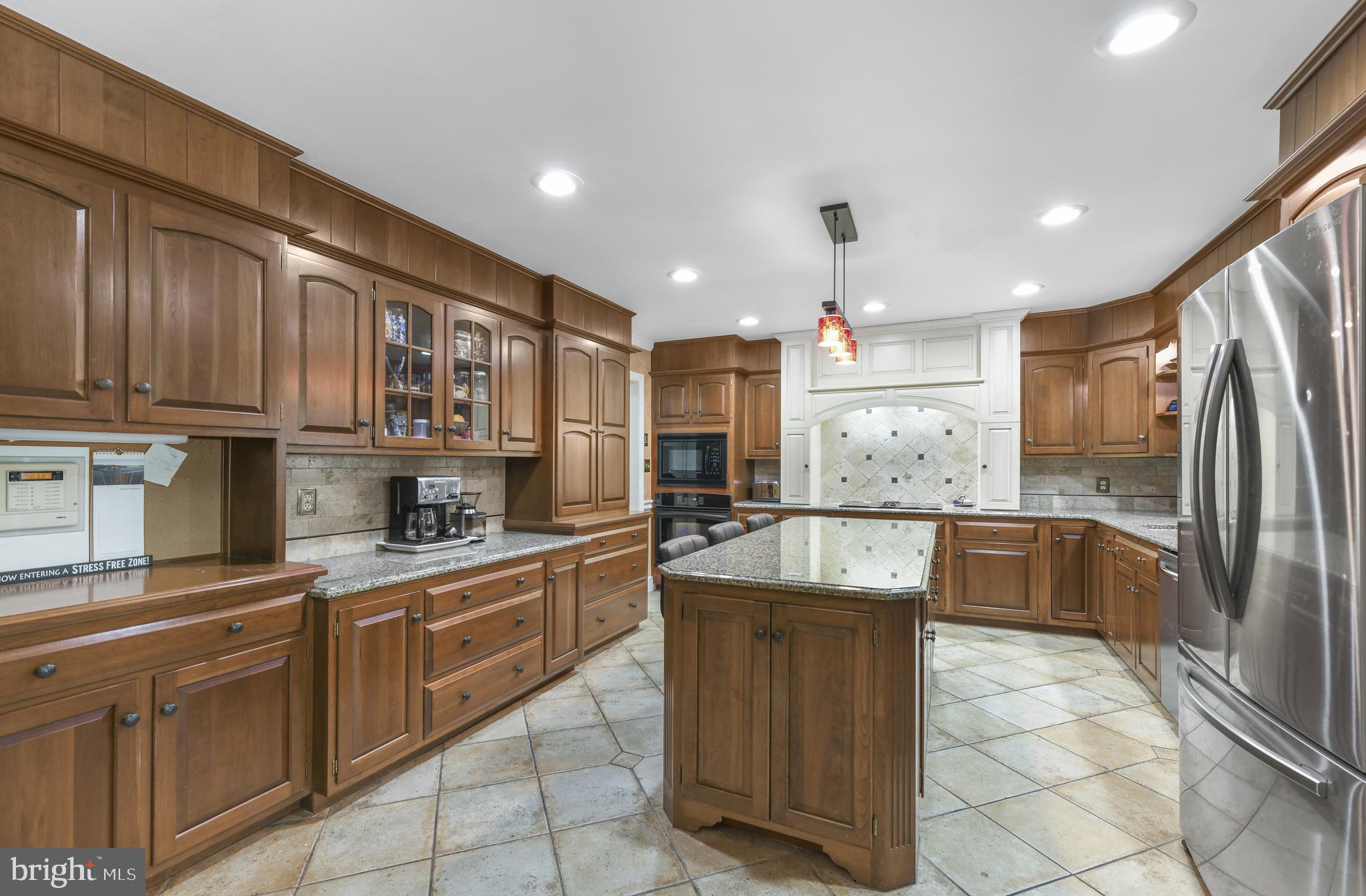 22 Fawn Drive Reading, PA 19607 - Photo 13 of 70 a large kitchen with stainless steel appliances granite countertop a sink and cabinets