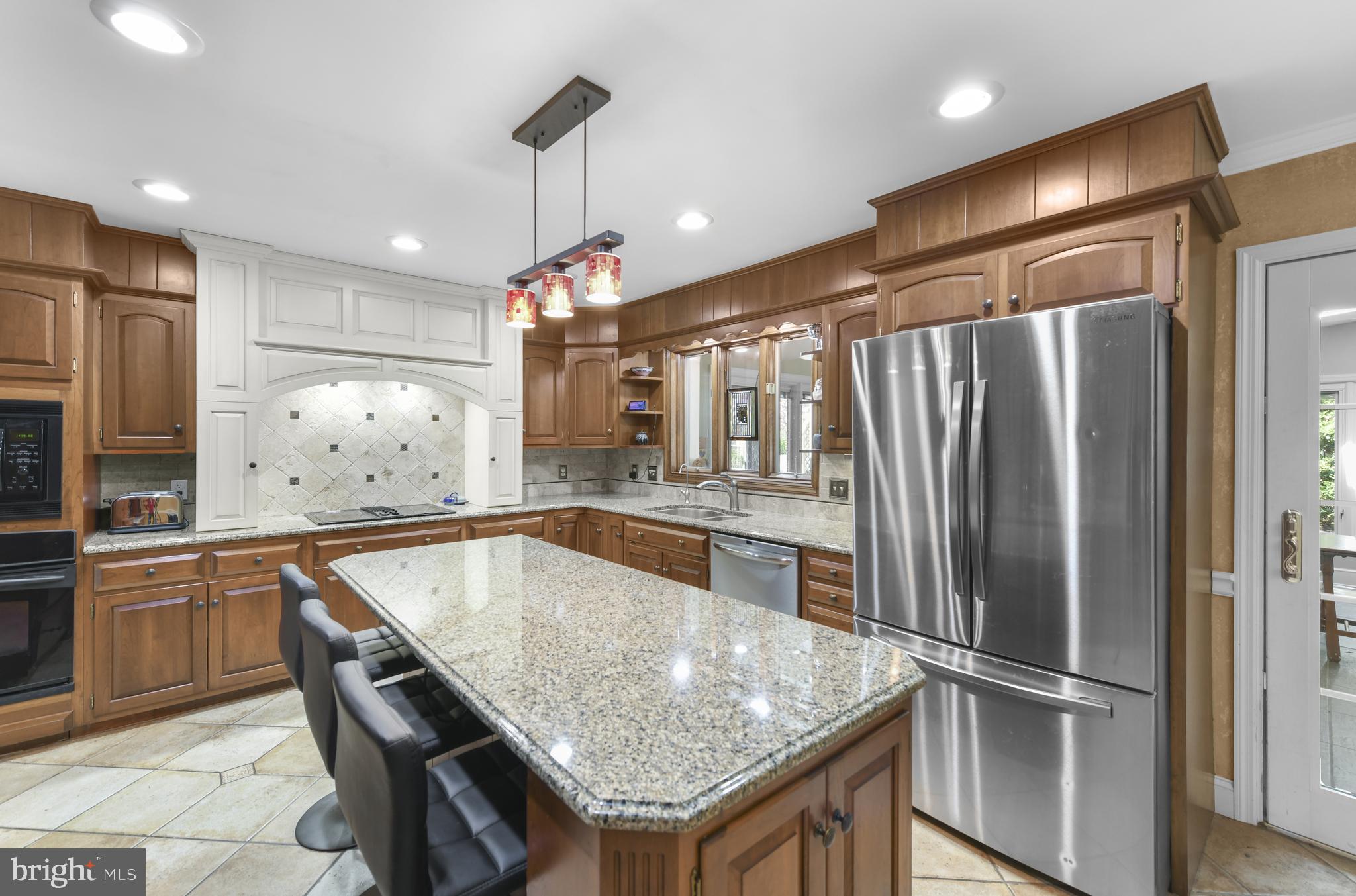 22 Fawn Drive Reading, PA 19607 - Photo 14 of 70 a kitchen with stainless steel appliances granite countertop a refrigerator a sink and a stove
