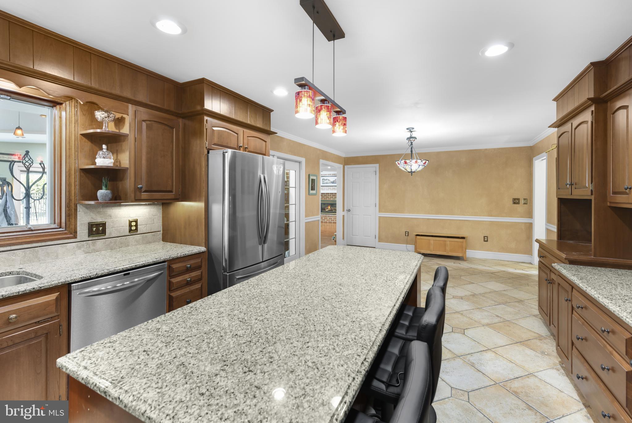 22 Fawn Drive Reading, PA 19607 - Photo 16 of 70 a kitchen with stainless steel appliances granite countertop a sink a stove and a refrigerator